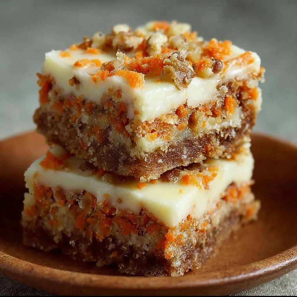 Delicious carrot cake cream cheese bars displayed on a white plate